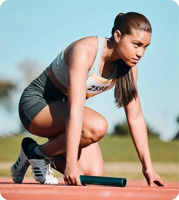 Female Athlete Starting Relay Track Astra Knee Pain