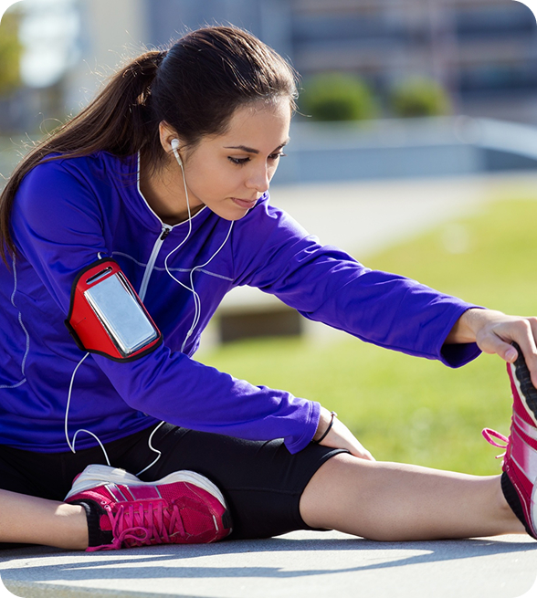 Female athlete warming up before a run on the stadium track