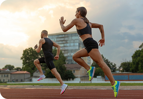 Runner in starting position on the track, ready for a race
