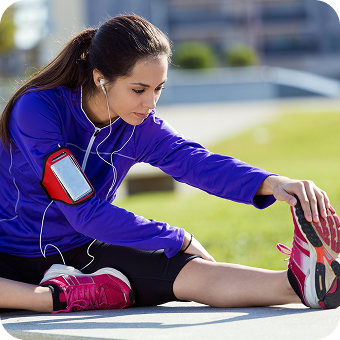 Young woman stretching and preparing for running