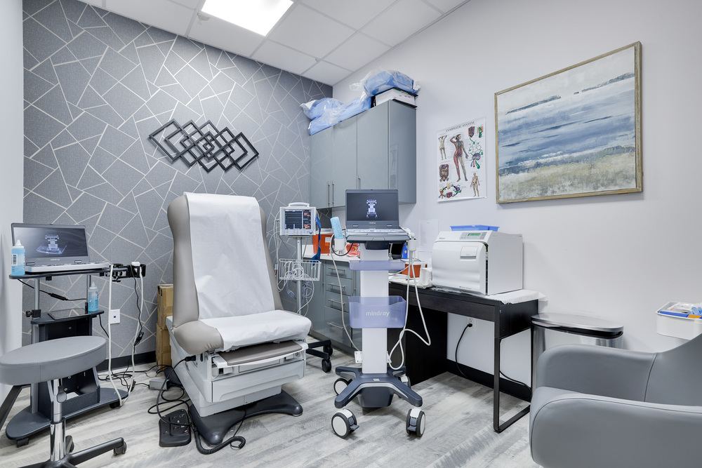 Modern pain treatment consultation room equipped with medical devices at Astra knee pain in Astoria Queens
