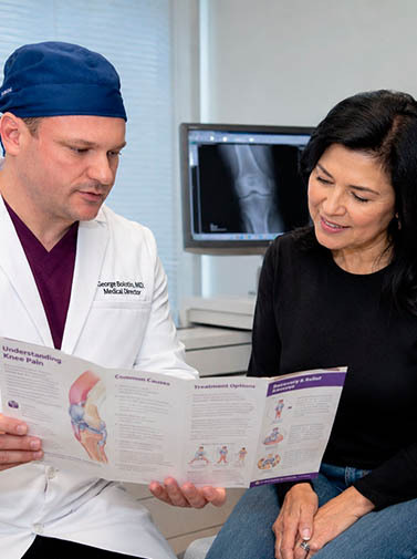 Knee pain doctor in Brooklyn and the Bronx helping patients at Astra Knee Pain Center with diagnosis, treatment planning, and chronic knee pain relief.