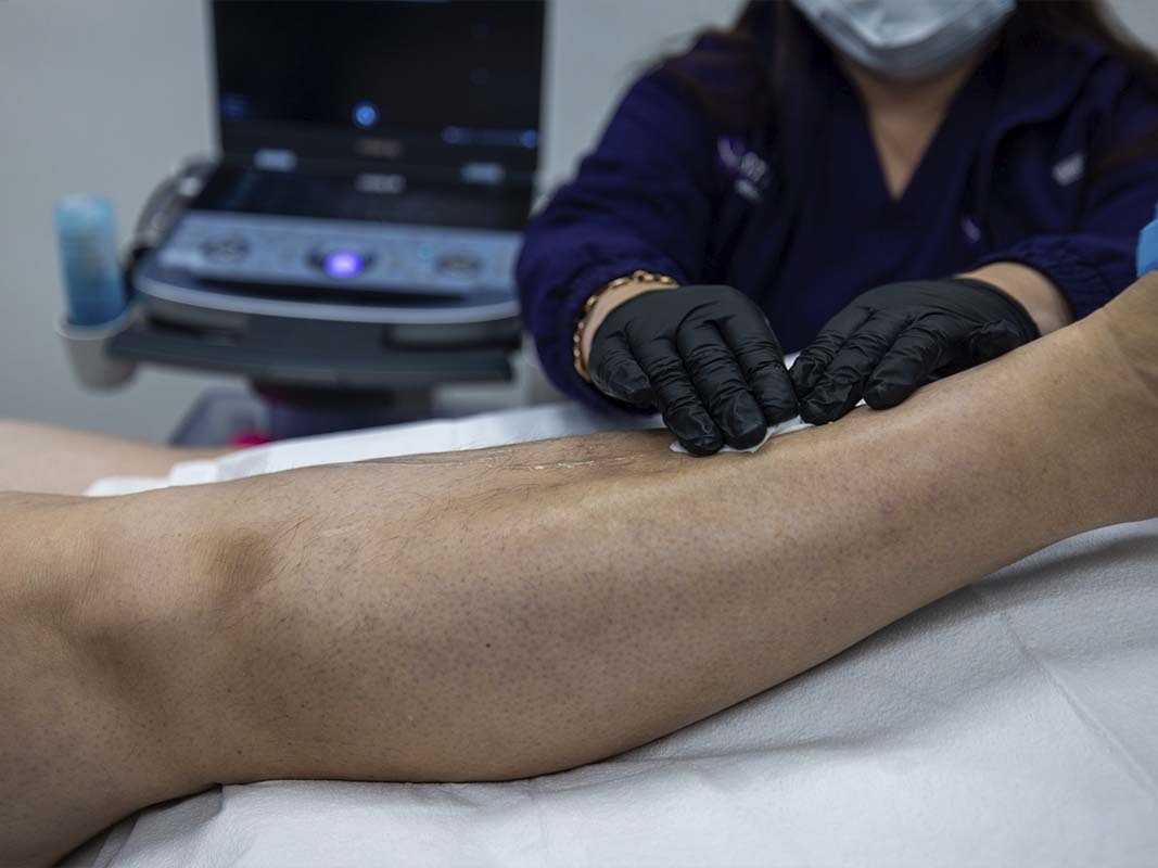 Dr. George Bolotin examining a patient’s knee for instability and locking symptoms in Brooklyn and the Bronx