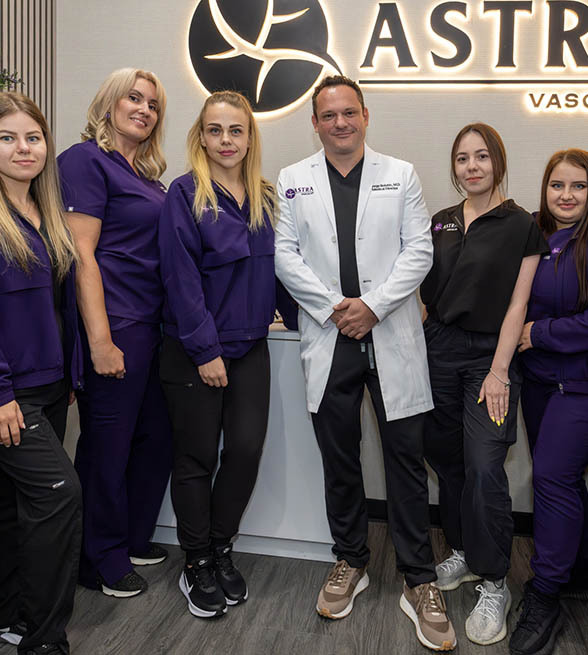 Astra Knee Pain Center team helping a patient begin non-surgical knee pain treatment in Brooklyn and the Bronx.